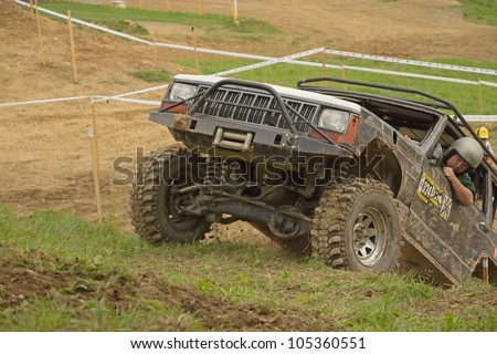 MOHELNICE, CZECH REPUBLIC - JUNE 10. Unidentified racer at off-road car leaves steep slope in the \