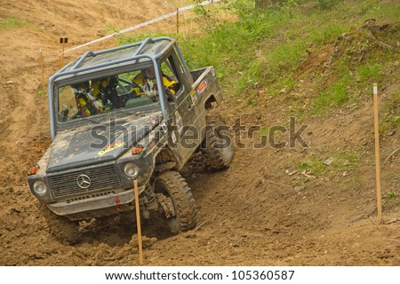 MOHELNICE, CZECH REPUBLIC - JUNE 10. Unidentified racer at off-road car in difficult terrain in the 