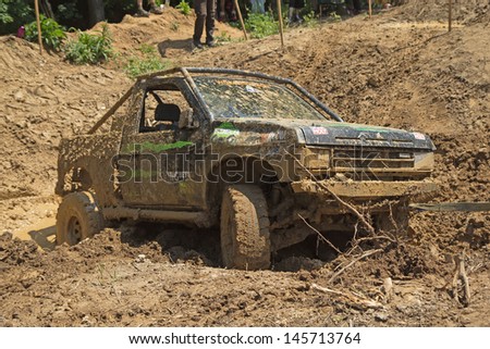 MOHELNICE, CZECH REPUBLIC - JUNE 09. Recovering off-road car from the muddy terrain in the \