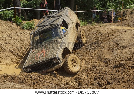 MOHELNICE, CZECH REPUBLIC - JUNE 09. Off road car stuck in a muddy terrain in the \