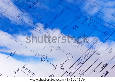 Sky with clouds and the floor plan of a house blueprint.