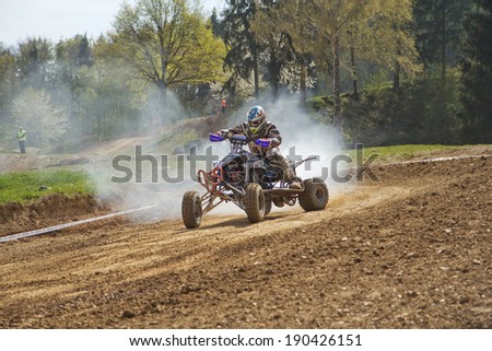 MOHELNICE,  CZECH REPUBLIC - APRIL 19: Racer is riding a quad with a smoking engine in the \