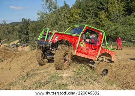 MOHELNICE,  CZECH REPUBLIC - SEPT 28: Small red off road car is hitting a steep hill in the BIG SHOCK! CUP of the Czech Republic. On September 28, 2014  in MOHELNICE, Czech Republic.