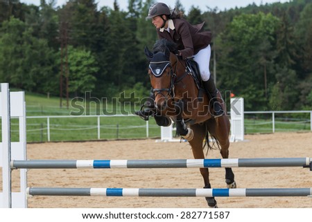 SVEBOHOV, CZECH REPUBLIC - MAY 23: Horsewoman jump on an obstacle at \