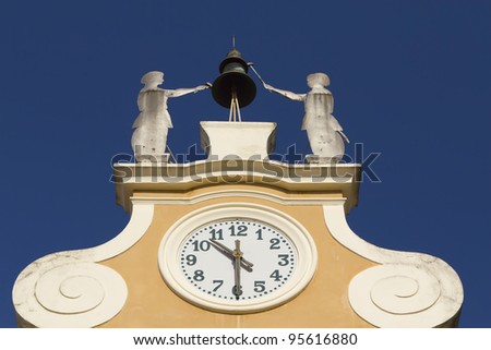 Clock Tower at Town Hall. Above the clock\'s bell and figures of two craftsmen. (Bardolino, Lake Garda, Italy)