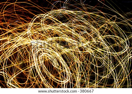 Light trails caused by long exposure and movement of the camera on outside electric lighting
