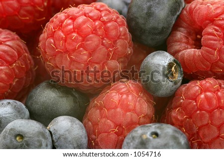 Close up macro shot of blueberries and raspberries
