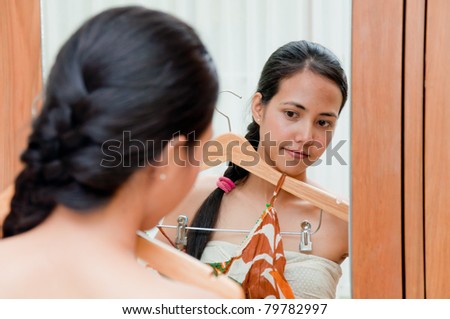 Beautiful Woman try cloth in dressing room