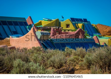 self sustainable living in energy efficient earthship high mountain desert Taos, New Mexico