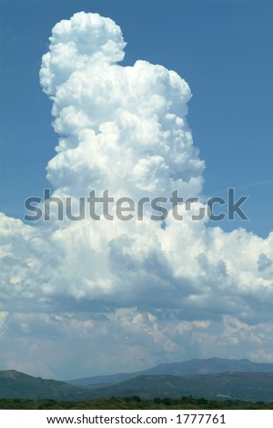 Massive cumulus cloud builds vertically before releasing its storm