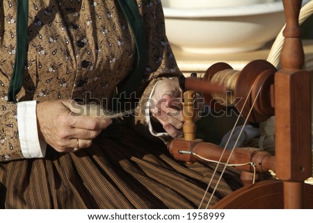 Civil War reenactment lady spinning yarn