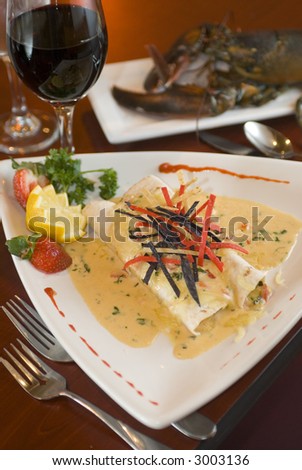 Gourmet fresh lobster rolls with cream sauce and red wine
