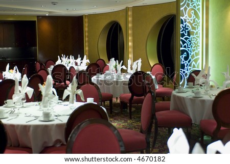 Elegant upscale restaurant table scene environment with silverware and glasses