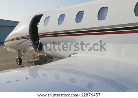 Corporate private luxury jet at airport door open