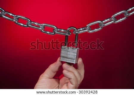 chain open lock on red background