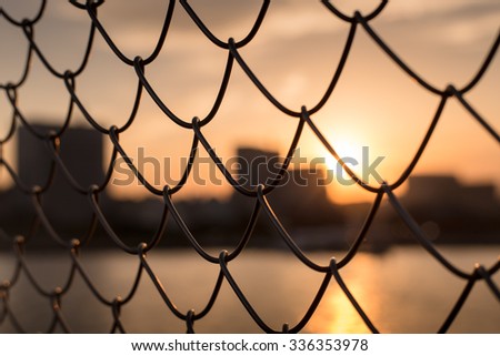 sunset through the fence