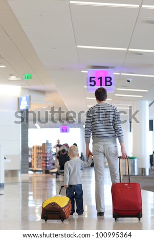 father and son together at the airport