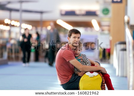 family of father and his son waiting at the airport