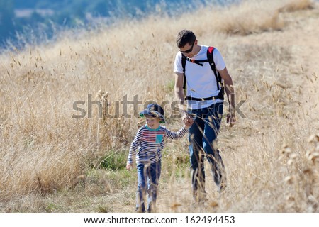 happy family of two enjoying nature hike together