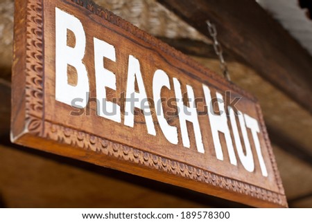 close-up view of beach hut sign