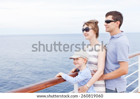 family of three enjoying vacation at cruise ship