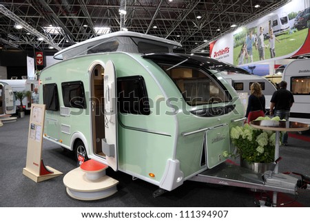 DUSSELDORF - AUGUST 27: Dethleffs Tourist mobile home with elevating roof at the Caravan Salon Exhibition 2012 on August 27, 2012 in Dusseldorf, Germany