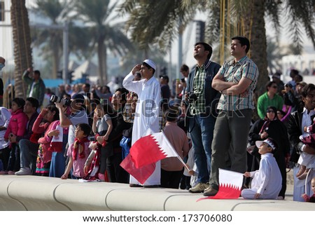 DOHA, QATAR - DEC 18: Spectators watching the Qatar National Day Air Show from the Corniche. December 18th 2013 in Doha, Qatar, Middle East