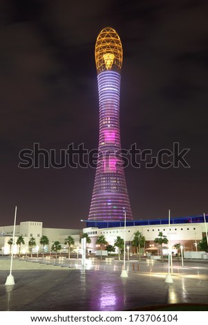 DOHA, QATAR - DEC 15: The Aspire Tower or Torch Hotel in Doha Sports City at night. December 15 2013 in Doha, Qatar, Middle East
