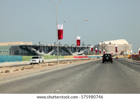 DOHA, QATAR - DEC 18: Al Rayyan Road in Doha. Qatar Nationnal Convention Centre on the left. December 18th 2013 in Doha, Qatar, Middle East