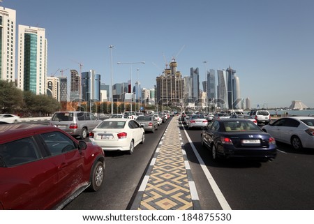 DOHA, QATAR - DEC 14: Traffic on the corniche road in Doha. December 14th 2013 in Doha, Qatar, Middle East