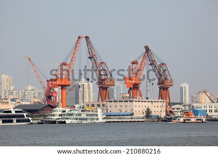 SHANGHAI, CHINA - NOV 18: Cranes at the port in Shanghai. November 18, 2010 in Shanghai, China