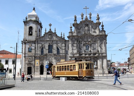 PORTO, PORTUGAL - JULY 1: Vintage tramway in front of a cathedral in Porto. July 1, 2010 in Porto, Portugal