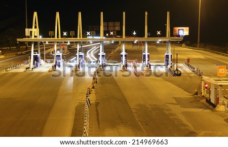MANILVA, SPAIN - NOV 22: Highway toll collection point at night. November 22, 2012 in Manilva, Andalusia, Spain