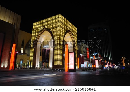 DUBAI, UAE - FEB 11: The Dubai Mall entrance illuminated at night. February 11, 2009 in Dubai, United Arab Emirates