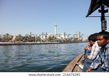 DUBAI, UAE - MAY 27: Crossing the Dubai Creek in a traditional Abra boat. May 27, 2011 in Dubai, United Arab Emirates