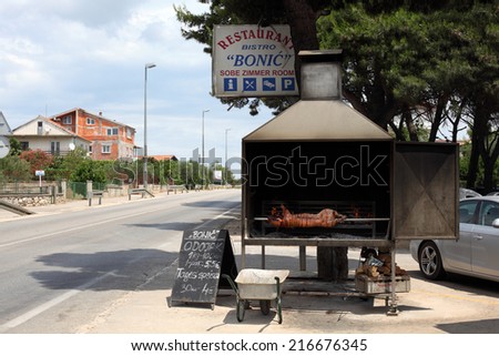SIBENIK, CROATIA - JULY 5: Traditional Croatian Restaurant with a piglet on a spitroast. July 5, 2011 in Dalmatia, Croatia