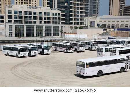 DUBAI, UAE - MAY 28: Bus parking in Dubai. These buses transport labours from camps to construction sites. May 28, 2011 in Dubai, United Arab Emirates