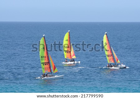 FUERTEVENTURA, SPAIN - JUNE 3: Colorful catamarans sailing in the atlantic ocean near Morro Jable. June 3, 2009 on Canary Island Fuerteventura, Spain