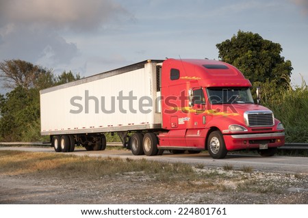 FLORIDA, USA - NOV 21: Red Freightliner Century Class semi-trailer truck. November 21, 2009 in Florida, USA