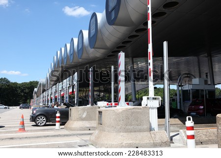 PARIS, FRANCE - JULY 3, 2014: Drivers pay road toll for using the highway A10. July 3, 2014 in Paris, France.