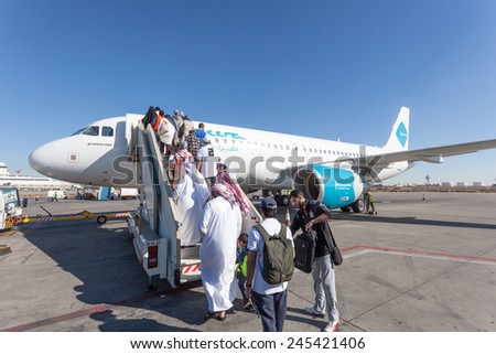 KUWAIT - DECEMBER 12: Jazeera Airways airplane boarding at the Kuwait International Airport. December 12, 2014 in Kuwait City, Middle East