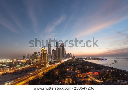 Dubai Marina Towers and Arabian Gulf coast at night. Dubai, United Arab Emirates