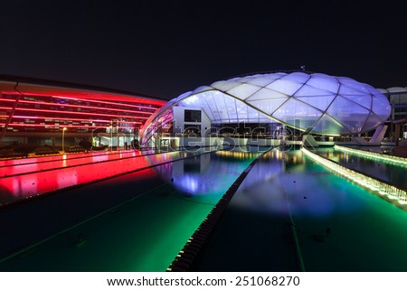 ABU DHABI - DEC 19: Ferrari World Theme Park illuminated at night. December 19, 2014 at the Yas Island in Abu Dhabi, UAE