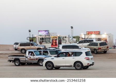 MADINAT ZAYED, UAE - DEC 22: Emirati people in their cars at the Al Dhafra Camel Festival in Al Gharbia. December 22, 2014 in Madinat Zayed, Emirate of Abu Dhabi, UAE