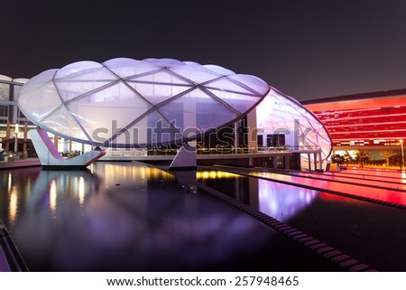 ABU DHABI - DEC 19: Ferrari World Theme Park illuminated at night. December 19, 2014 at the Yas Island in Abu Dhabi, UAE