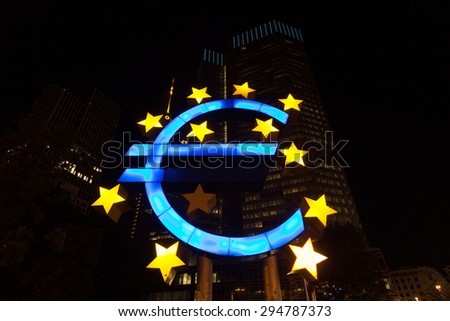 FRANKFURT MAIN - JUNE 27: Euro Sign near the old European Central Bank in the city of Frankfurt at night. June 27, 2015 in Frankfurt Main, Germany