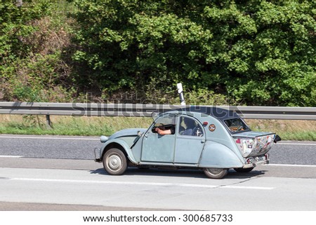 FRANKFURT, GERMANY - JULY 26: Old Citroen 2CV with boot extension moving on the highway A5 near Frankfurt. July 26, 2015 in Frankfurt Main, Germany