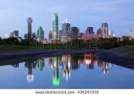 Dallas downtown skyline illuminated at night with reflection in the Trinity River. Texas, United States