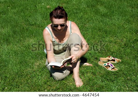 Senior lady reading outside