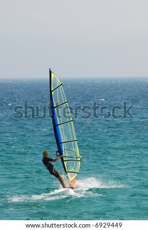 Windsurfer sailing away
